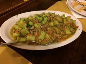green gnocchi with meat sauce