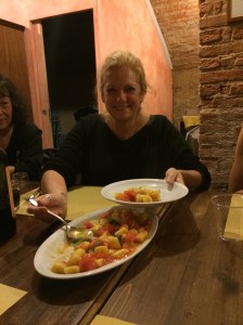 Me serving gnocchi with tomato garlic sauce